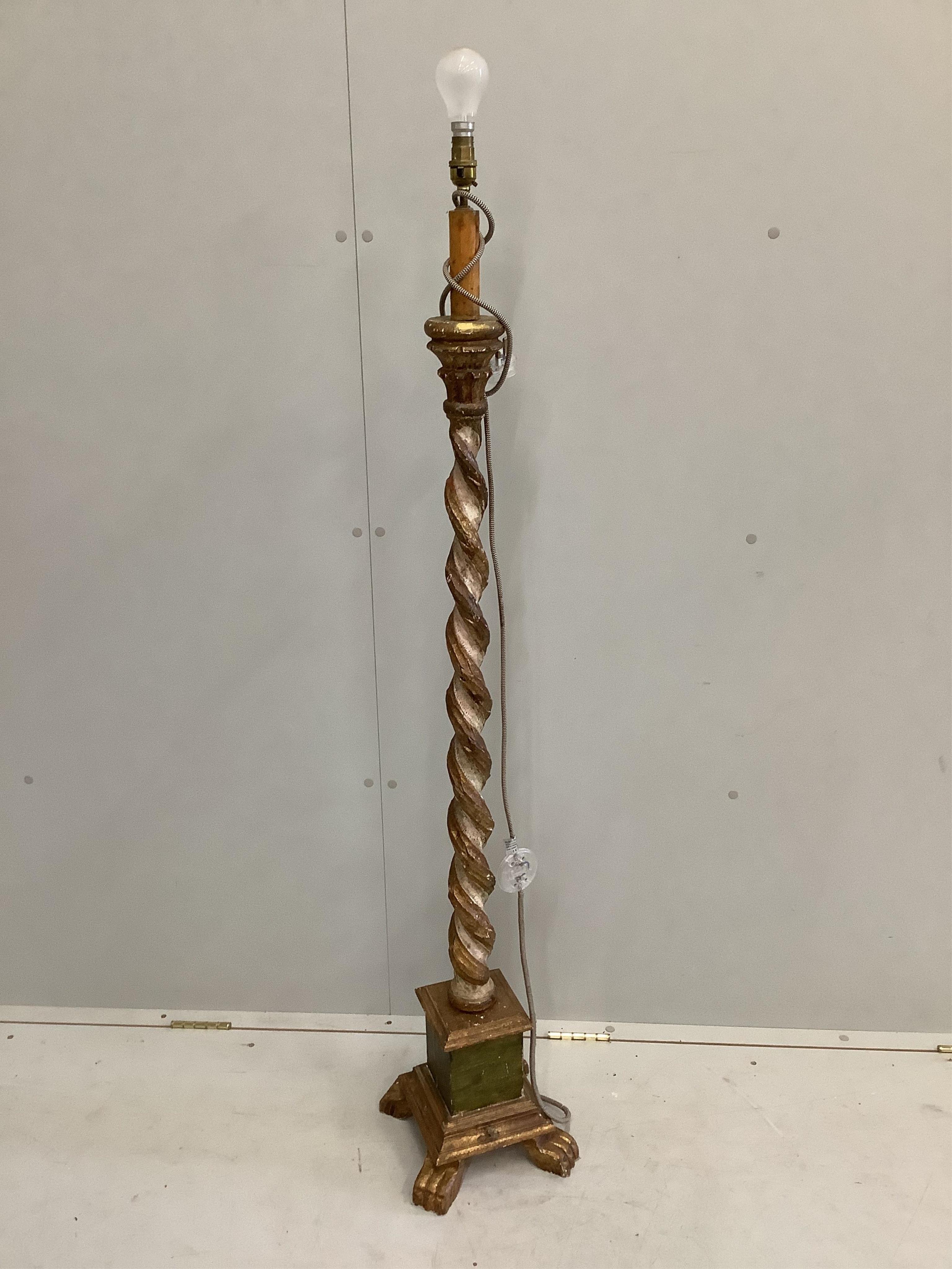 An 18th century style carved parcel-gilt barley twist standard lamp, height 140cm